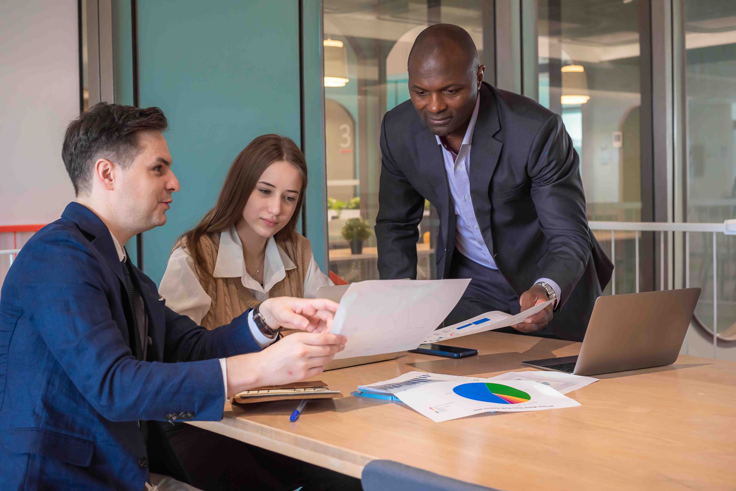 Accounting professionals reviewing financial documents together